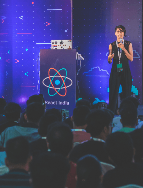 A woman speaking at React India 2019
